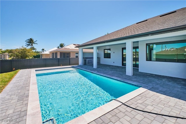 view of swimming pool featuring a fenced backyard, a patio, and a fenced in pool