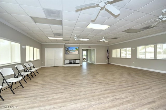 677 12th Ave S Unit 677, Naples, FL 34102 - living room with ceiling fan, crown molding, and light wood-type flooring