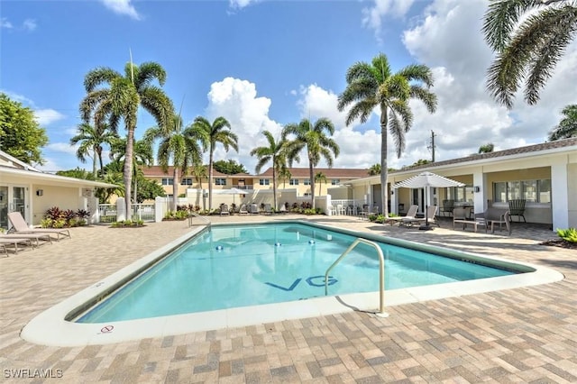 677 12th Ave S Unit 677, Naples, FL 34102 - community pool with fence, a patio area, and french doors