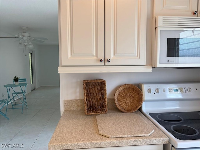 677 12th Ave S Unit 677, Naples, FL 34102 - interior space featuring light countertops, white appliances, a ceiling fan, and light tile patterned flooring