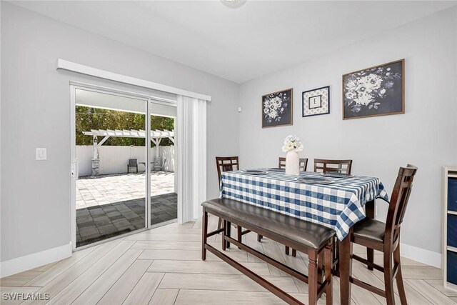 dining room with baseboards