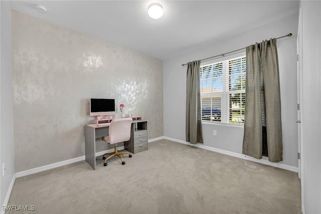 home office featuring carpet and baseboards