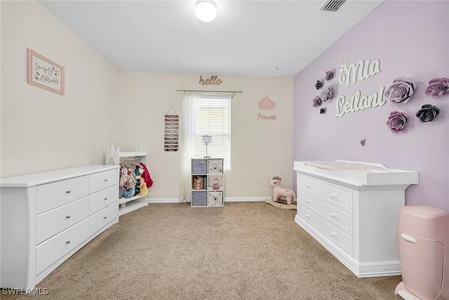 bedroom with light colored carpet, visible vents, and baseboards
