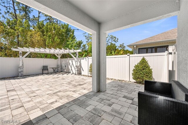 view of patio / terrace featuring a pergola and a fenced backyard