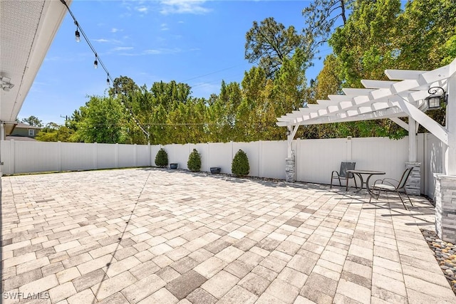 view of patio featuring a pergola and a fenced backyard
