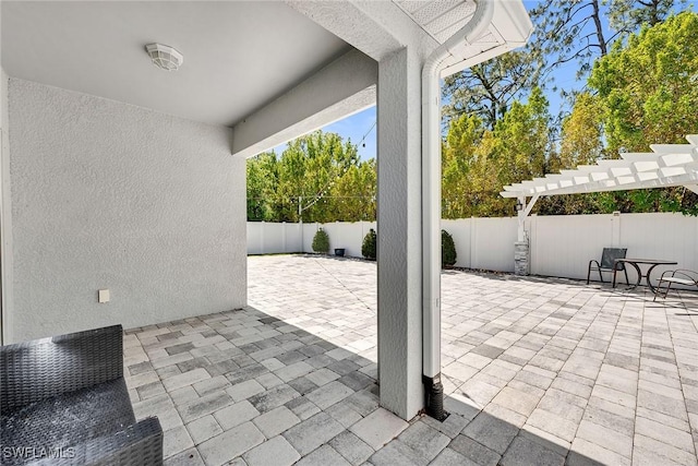 view of patio with a fenced backyard and a pergola