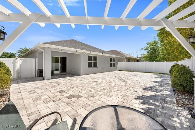 view of patio / terrace featuring a fenced backyard and a pergola