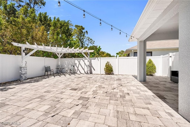view of patio / terrace with a fenced backyard and a pergola