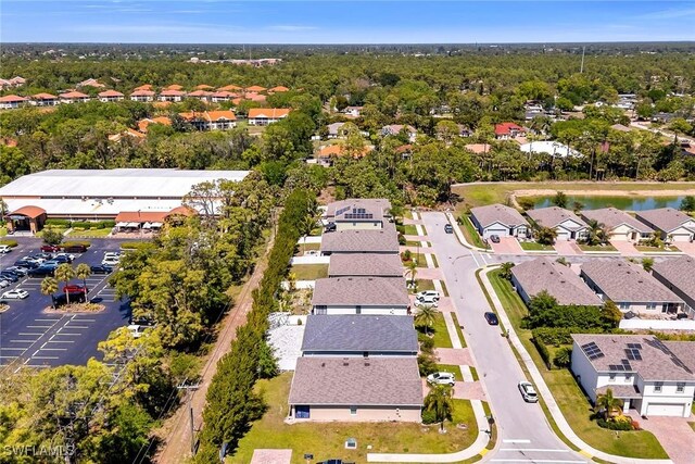 birds eye view of property with a residential view