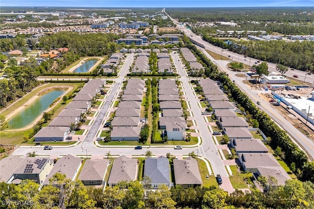 aerial view featuring a residential view and a water view