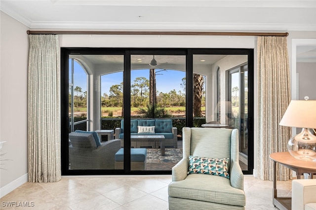 doorway featuring baseboards, ornamental molding, and tile patterned flooring
