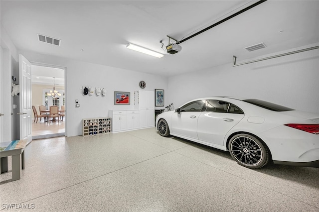 garage with visible vents and a garage door opener