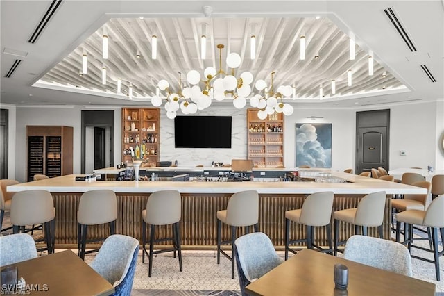 bar with a bar, crown molding, and visible vents
