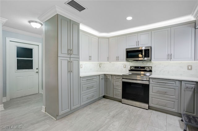 2324 Westwood Rd, North Fort Myers, FL 33917 - kitchen featuring gray cabinets, appliances with stainless steel finishes, light countertops, and visible vents