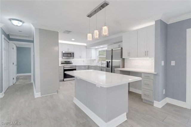 2324 Westwood Rd, North Fort Myers, FL 33917 - kitchen with crown molding, visible vents, decorative backsplash, and stainless steel appliances