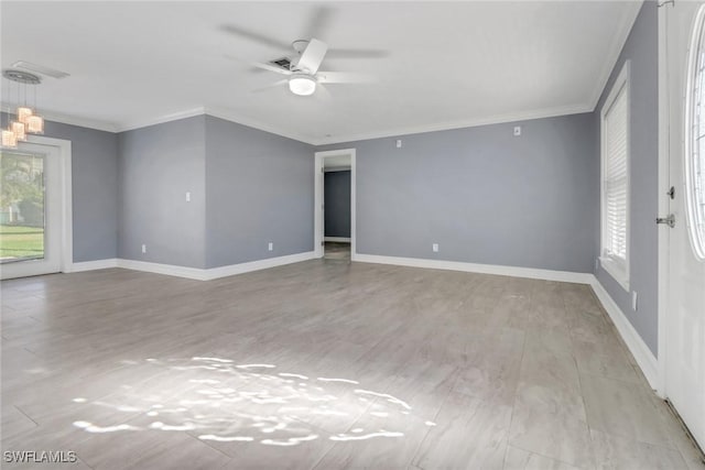 2324 Westwood Rd, North Fort Myers, FL 33917 - spare room featuring wood finished floors, ceiling fan, and ornamental molding