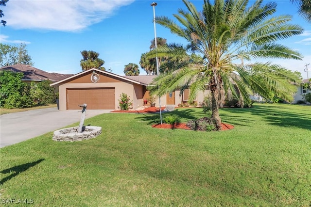 2324 Westwood Rd, North Fort Myers, FL 33917 - view of front facade featuring an attached garage, concrete driveway, stucco siding, and a front yard