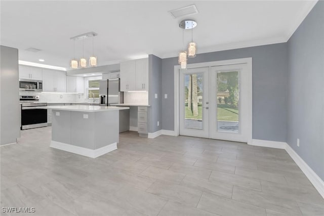 2324 Westwood Rd, North Fort Myers, FL 33917 - kitchen featuring white cabinetry, visible vents, light countertops, stainless steel appliances, and french doors