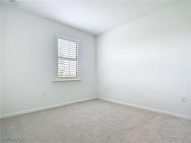 6329 Honor Way, Ave Maria, FL 34142 - empty room with light colored carpet and baseboards