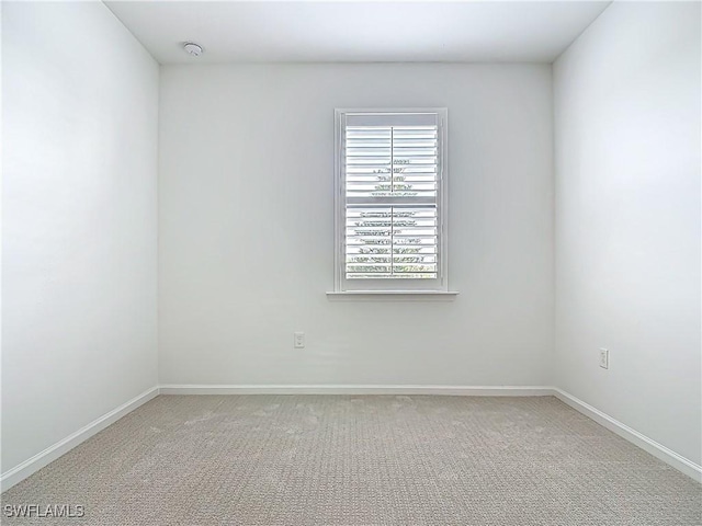 6329 Honor Way, Ave Maria, FL 34142 - spare room featuring light colored carpet and baseboards