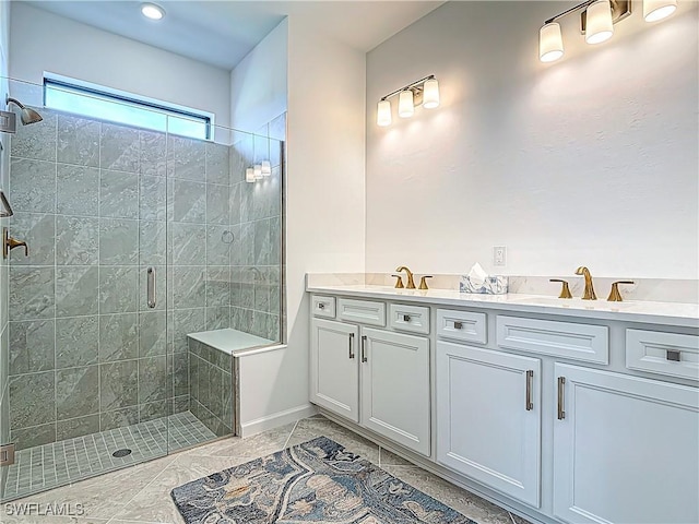 full bath with double vanity, a sink, and a stall shower