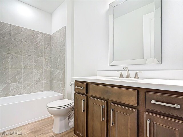 6329 Honor Way, Ave Maria, FL 34142 - bathroom with toilet, wood finished floors, vanity, and bathtub / shower combination