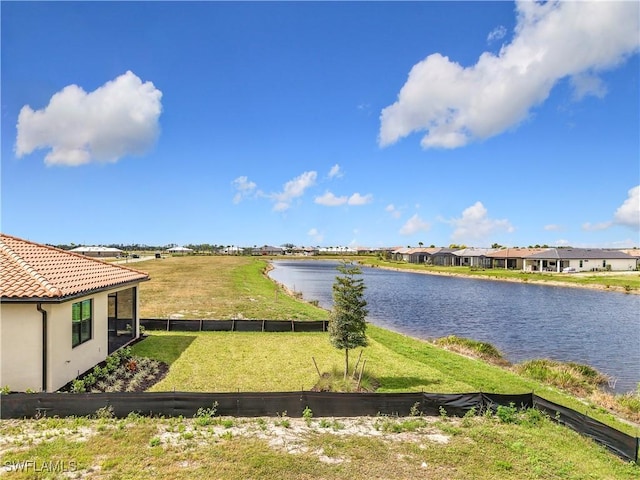 water view featuring a residential view and fence