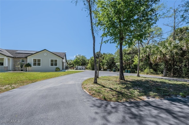 view of street featuring driveway