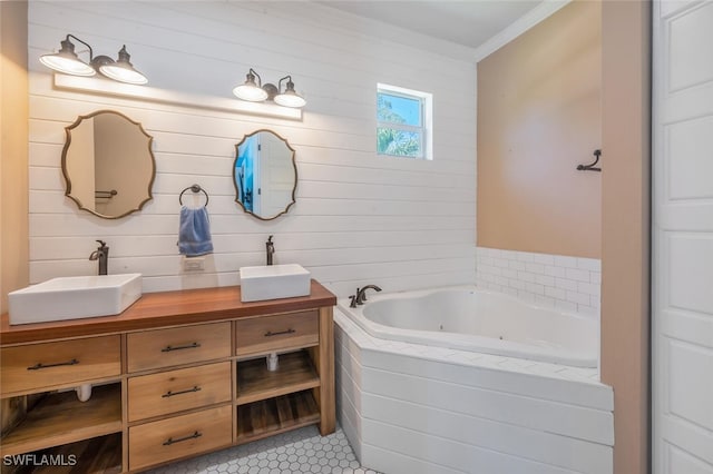 full bathroom with a sink, tile patterned floors, a tub with jets, and double vanity