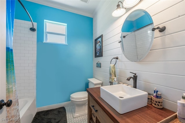 482 10th Ave NW, Naples, FL 34120 - bathroom featuring shower / bath combo with shower curtain, vanity, tile patterned flooring, and ornamental molding