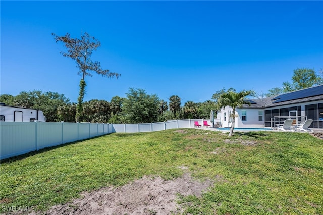 view of yard with a fenced in pool, a fenced backyard, and a sunroom