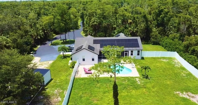 482 10th Ave NW, Naples, FL 34120 - view of subject property with a heavily wooded area and a pool