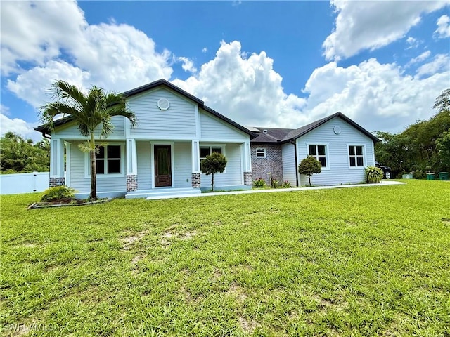 482 10th Ave NW, Naples, FL 34120 - ranch-style house featuring covered porch