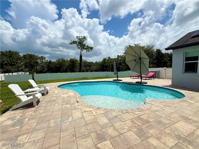 482 10th Ave NW, Naples, FL 34120 - view of swimming pool featuring a patio area and a fenced backyard