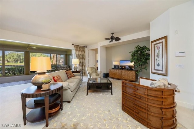 730 Waterford Dr Unit 102, Naples, FL 34113 - living area with baseboards and ceiling fan