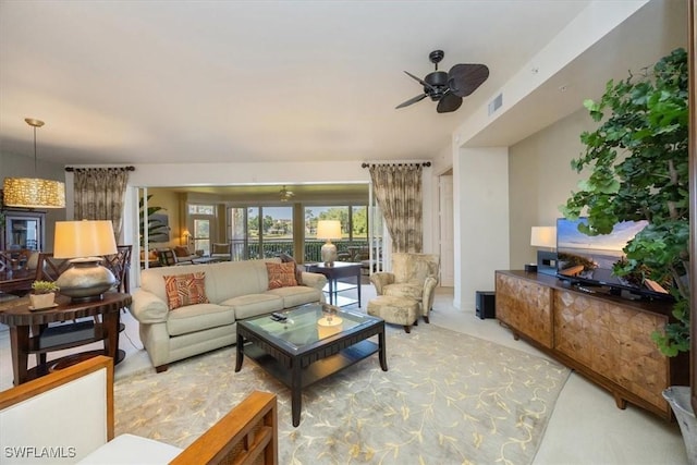 730 Waterford Dr Unit 102, Naples, FL 34113 - living room featuring visible vents, carpet, and ceiling fan
