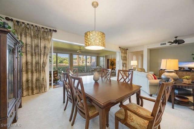 730 Waterford Dr Unit 102, Naples, FL 34113 - dining space featuring visible vents, light colored carpet, and ceiling fan