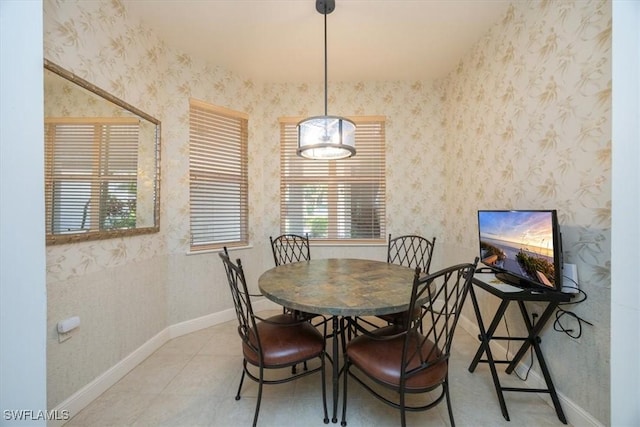 730 Waterford Dr Unit 102, Naples, FL 34113 - dining room with wallpapered walls and baseboards