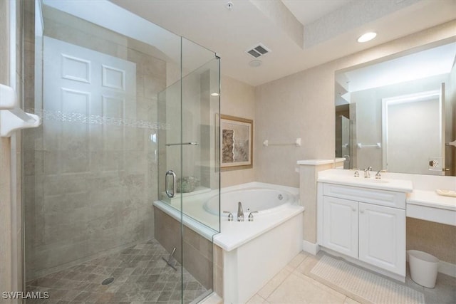 730 Waterford Dr Unit 102, Naples, FL 34113 - full bathroom featuring tile patterned flooring, vanity, a shower stall, a garden tub, and visible vents