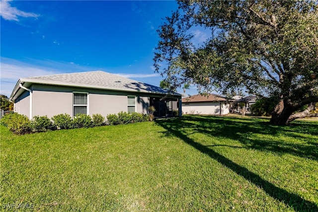 27260 Porto Nacional Dr, Punta Gorda, FL 33983 - view of front facade with a front lawn and stucco siding