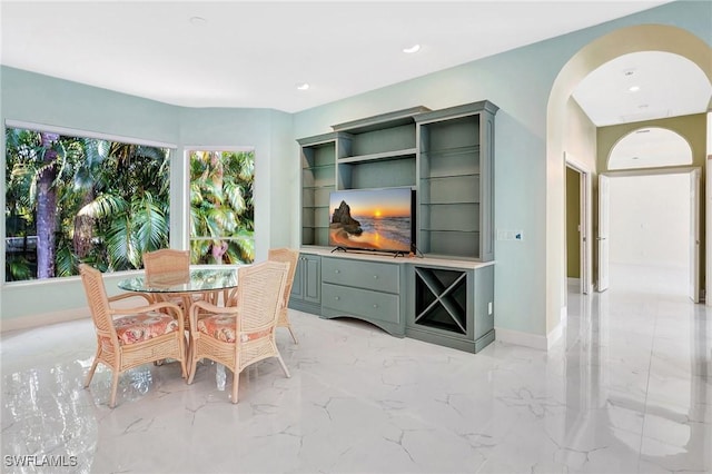 27231 Lakeway Ct, Bonita Springs, FL 34134 - dining room featuring arched walkways, marble finish floor, baseboards, and recessed lighting