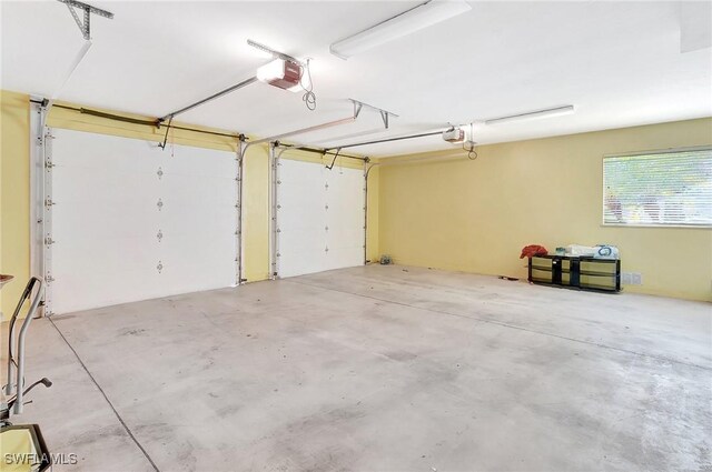27231 Lakeway Ct, Bonita Springs, FL 34134 - garage with a garage door opener