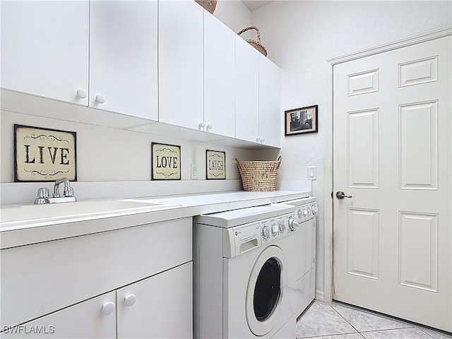 20716 Tisbury Ln, North Fort Myers, FL 33917 - clothes washing area featuring light tile patterned floors, independent washer and dryer, a sink, and cabinet space