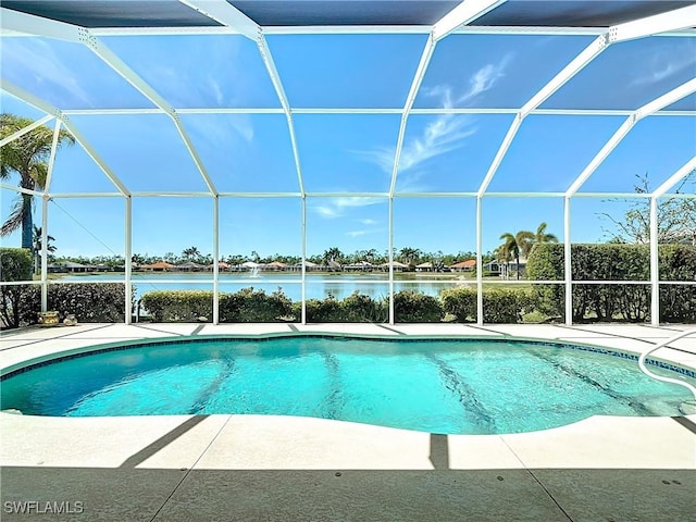 20716 Tisbury Ln, North Fort Myers, FL 33917 - pool featuring a patio area, a water view, and glass enclosure