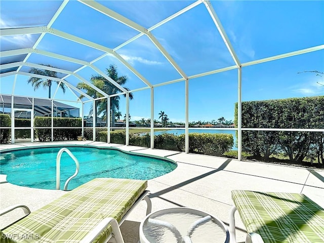 20716 Tisbury Ln, North Fort Myers, FL 33917 - outdoor pool with a water view, a patio area, and glass enclosure