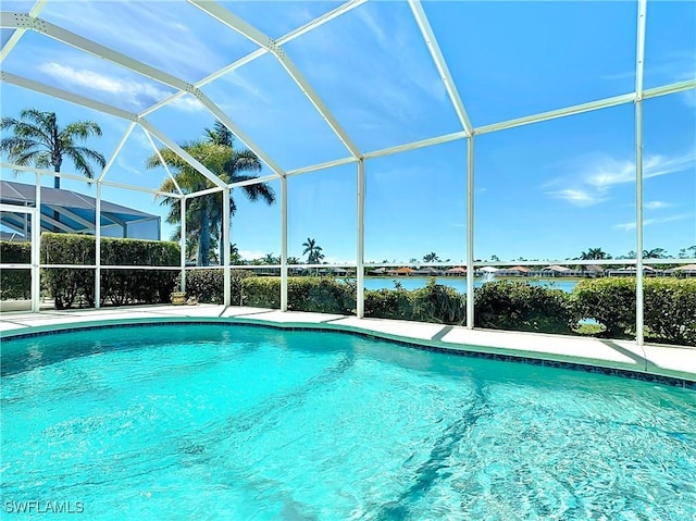 20716 Tisbury Ln, North Fort Myers, FL 33917 - outdoor pool featuring a water view and glass enclosure