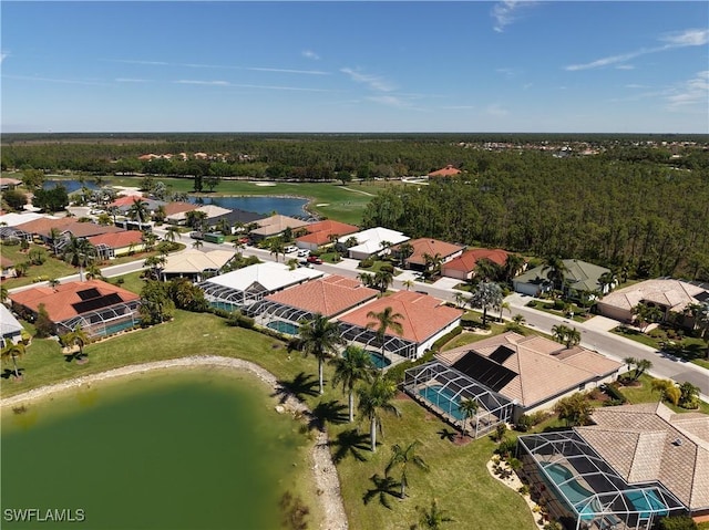20716 Tisbury Ln, North Fort Myers, FL 33917 - drone / aerial view with a wooded view, a residential view, and a water view