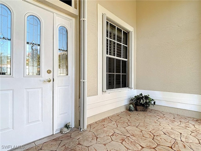 20716 Tisbury Ln, North Fort Myers, FL 33917 - view of exterior entry with stucco siding