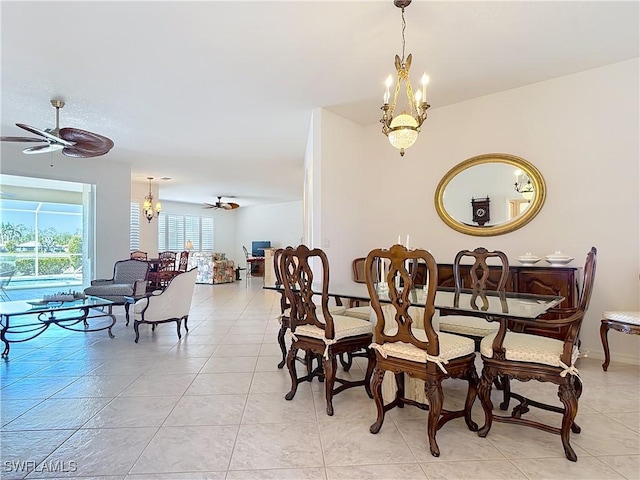 20716 Tisbury Ln, North Fort Myers, FL 33917 - dining space featuring light tile patterned flooring and ceiling fan with notable chandelier