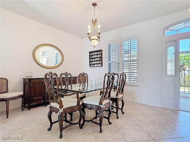 20716 Tisbury Ln, North Fort Myers, FL 33917 - dining room with baseboards, light tile patterned floors, a notable chandelier, and plenty of natural light